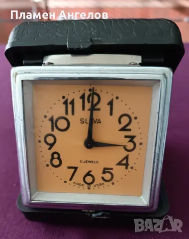 повреден механичен-турестически часовник " Slava". 