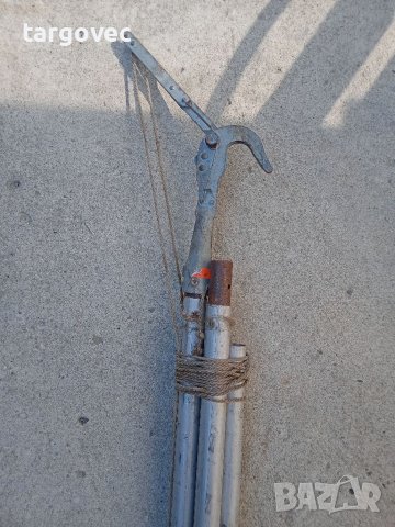 Удължена ножица за клони реже до седем метра