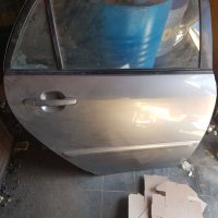 Toyota corolla 4/5  врати задна дясна , снимка 1 - Части - 40463684