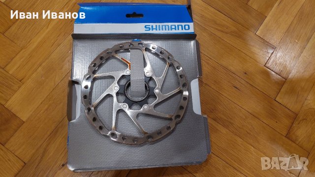 Спирачен Ротор Shimano 180mm CenterLock SM-RT64-M, снимка 1 - Части за велосипеди - 42610651