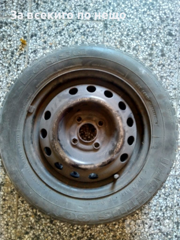 Метална джанта 4 х 100 с гума 185 / 60 R 14 , снимка 2 - Гуми и джанти - 36516137