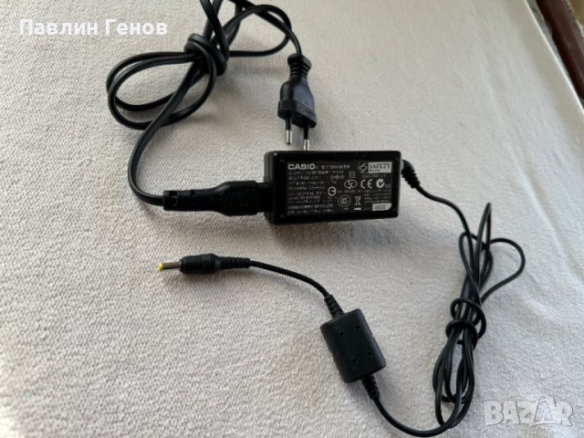 Оригинално зарядно за цифров фотоапарат CASIO AD-C51G , 5.3 Volt 650 mA, снимка 2 - Батерии, зарядни - 44561373