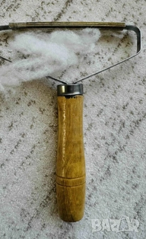   Ръчен уред за премахване на мъх и топчета от дрехи 