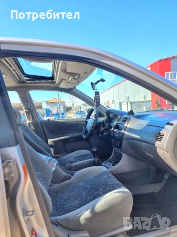 Mazda 323F Газ бензин, снимка 11 - Автомобили и джипове - 53581677