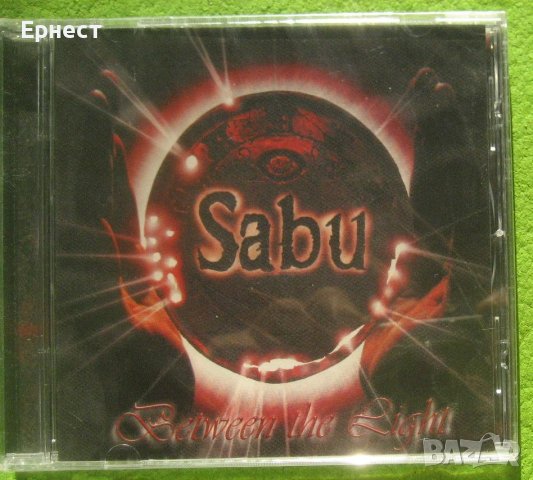 AOR Sabu – Between The Light, снимка 1 - CD дискове - 41977375
