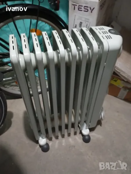 Електрически маслен радиатор DeLonghi, 2000W, 9 ребра, Защитен термостат, Дръжка, снимка 1