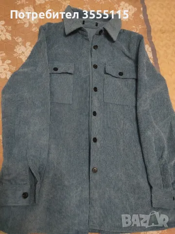 Дамска синя риза без следи от употреба рр С 12 лв 
гр.обиколка 45  см
Дължина 65 см