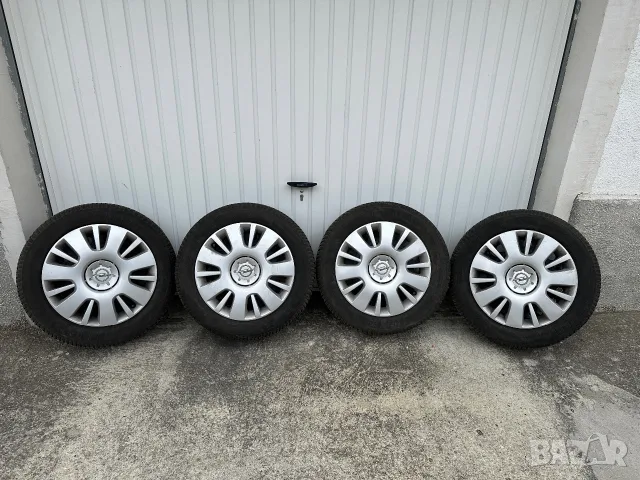 4 бр.  Зимни гуми 205/55/16 с оригинални джанти и тасове Opel