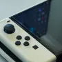 Nintendo Switch OLED 256GB + 4 Joy-Con-а + 2 игри + Carrying Case + подарък, снимка 3