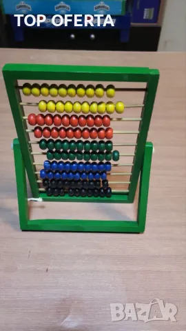 Дървено сметало с цветни топчета