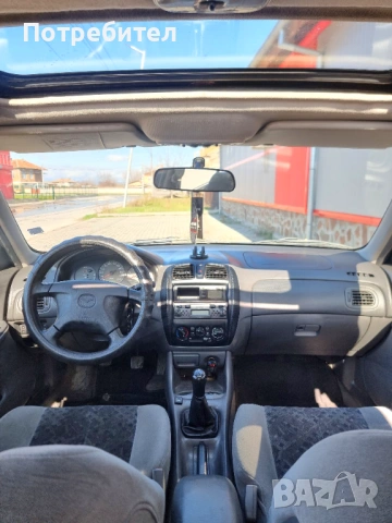 Mazda 323F Газ бензин, снимка 10 - Автомобили и джипове - 53581677