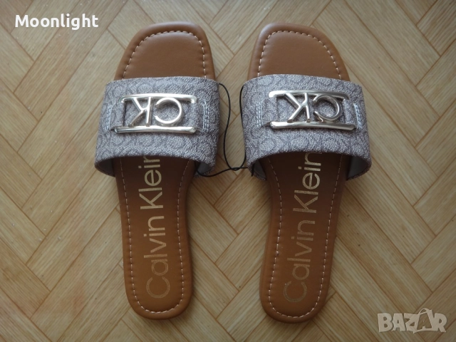 Нови оригинални чехли Calvin Klein номер 35 и 36 в кафяво и бежово с метално лого
