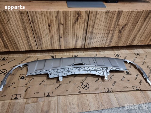 Оригинална добавка за задната броня при VW Passat B7 Alltrack, снимка 2 - Части - 39873444