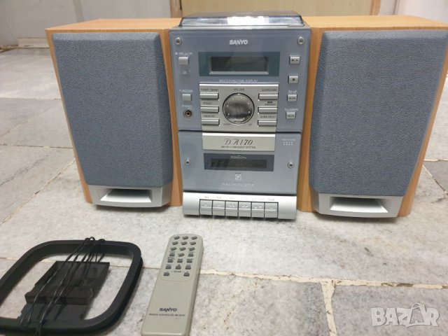 Аудиосистема Sanyo DA170 с две колони и дистанционно. Всичко и работи. В много добро състояние е. Им
