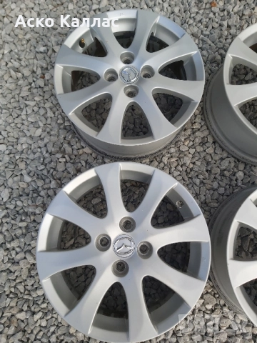 4х100. 15.цола.6j.ET45 оргинални Mazda, снимка 2 - Гуми и джанти - 51829747