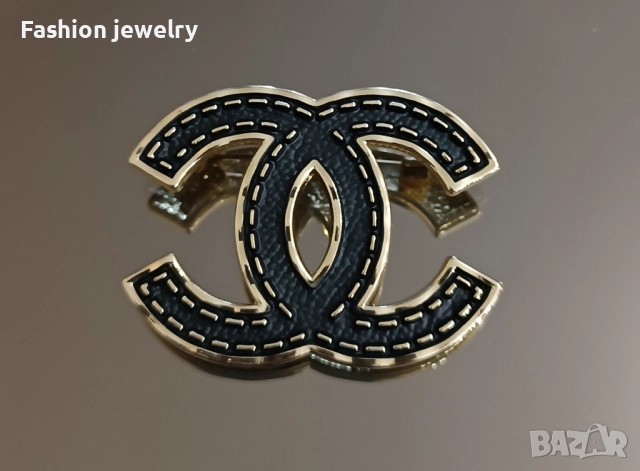 Брошки Chanel
