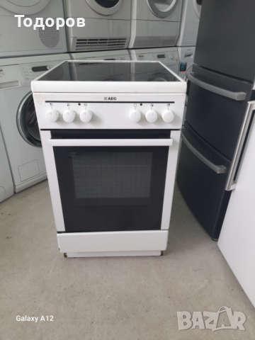 Готварска печка AEG, INOX с керамичен плот и фурна с вентилатор 50 см шир.