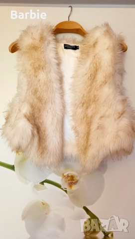 Дамски пухен елек