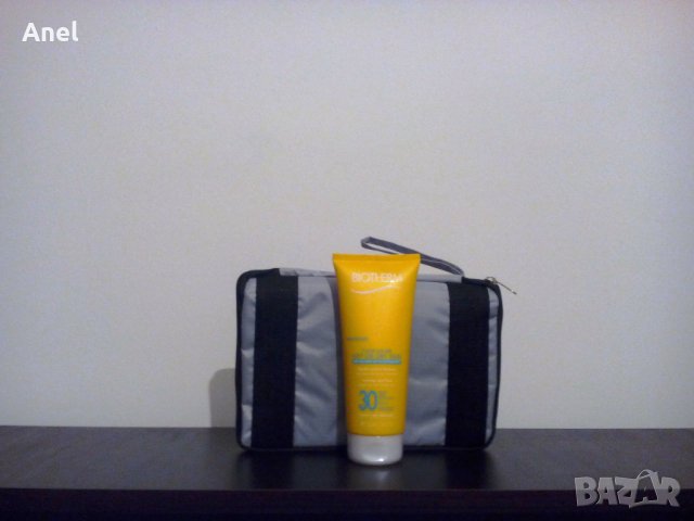 Промо оферта: Biotherm Fluide Solaire SPF 30 Wet or Dry Skin слънцезащитен продукт + сгъваема чанта, снимка 2 - Козметика за лице - 28754914