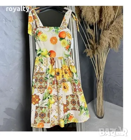 Кокетна лятна рокля с портокали и панделки