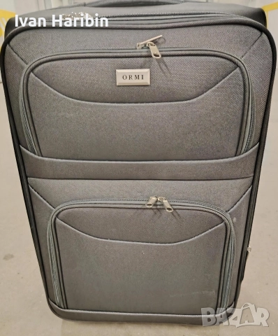 Продавам голям куфар с колелца и телескопична дръжка 