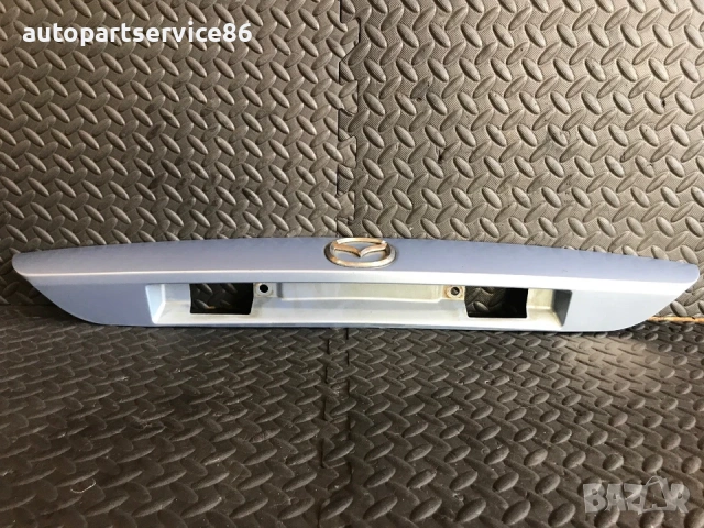 Дръжка за отваряне на задния капак за регистрационен номер синя за Mazda 626 (2001) GG3E50810