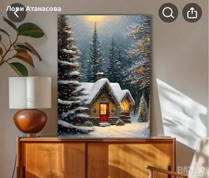 Платно с топла зимна къща в снежна гора, украсена с празнични светлини и червена врата., снимка 1