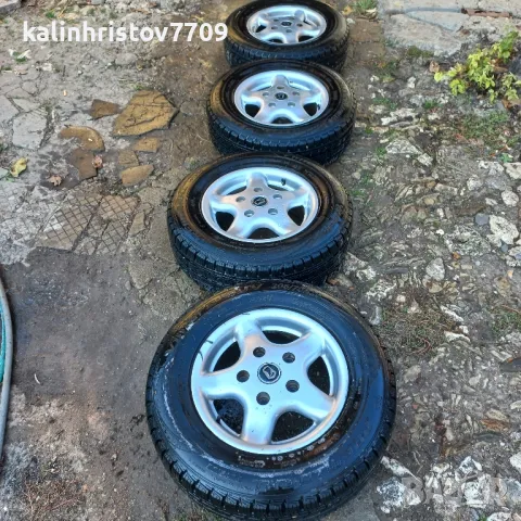 Зимни гуми с ал. джанти 205/70 R15, снимка 2 - Гуми и джанти - 47619048