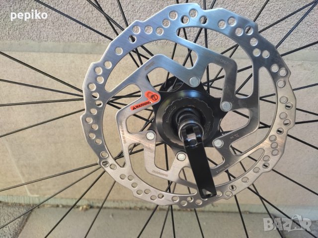 Продавам колела внос от Германия  алуминиева предна капла с диск SHIMANO SM-RT10-M 28 цола, снимка 9 - Части за велосипеди - 41808938