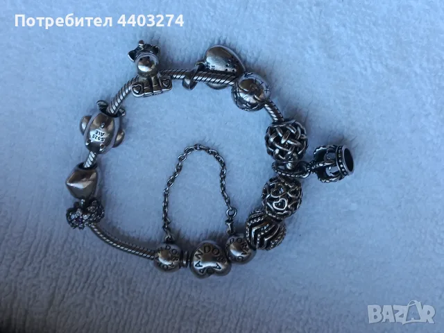 сребърна гривна pandora с 12 талисмана.