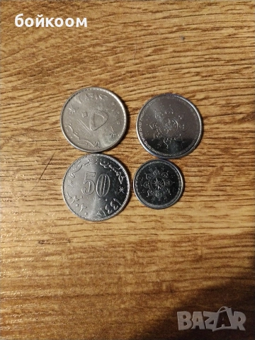 монети Оман