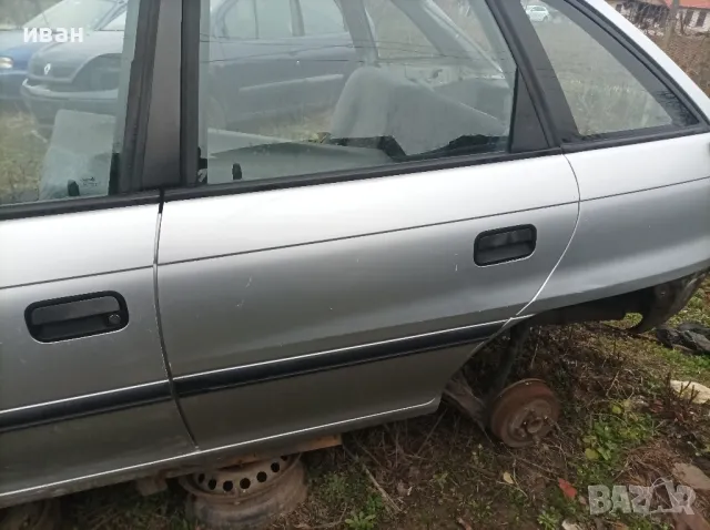 Задна лява врата за Опел Астра F хечбек. 93 год. сива. 