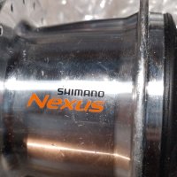 Нова  задна  главина-   SHIMANO - NEXSUS ,с  7 вътрешни скорости  , свободен венец  ., снимка 1 - Части за велосипеди - 41396775