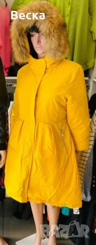 Продавам дълго зимно дамско яке в жълт цвят