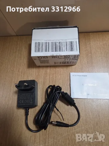 Захранващ адаптер модел J151-1801000EX с изходно напрежение 18.0V и ток 1.0A.