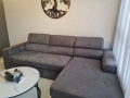 Ъглов диван, удобен и практичен. Изработен от качествен текстил в тъмно сив цвят. Разполага с функ, снимка 3