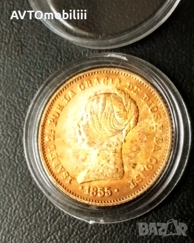 Позлатена испанска монета в капсула