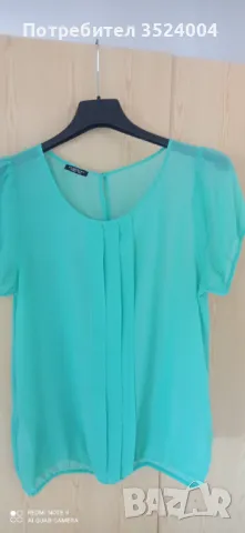 Нова елегантна копринена блуза на марка Motivo техния размер е 44