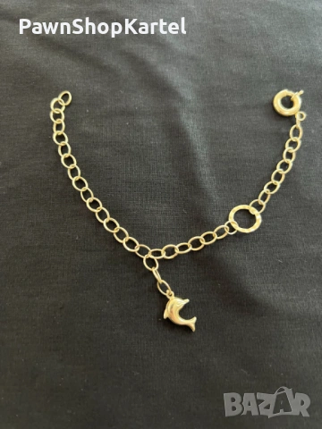 Продавам Златна гривна 14К с висулка делфин 