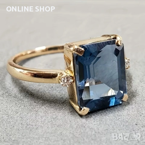 Елегантен златен пръстен със синя изтънченост нов