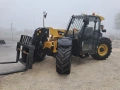 Телескопичен товарач Caterpillar TH407C, снимка 9