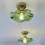 Зелен стъклен полилей с медни/месингови детайли, снимка 1