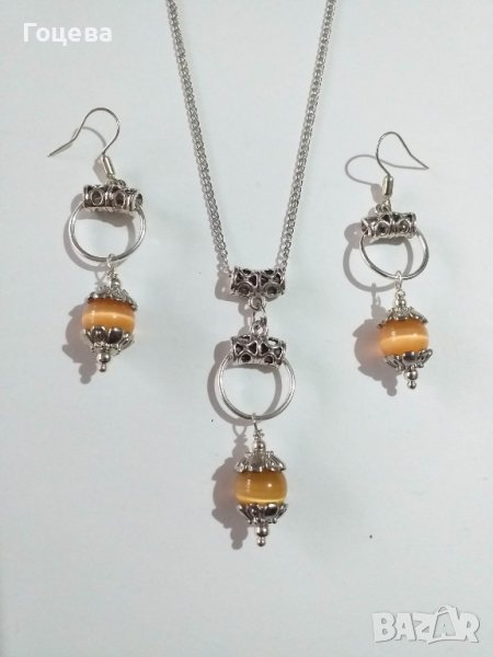 Прекрасният ни нов комплект бижута с оранжеви камъни Котешко око и орнаменти в цвят Сребро , снимка 1