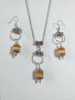 Прекрасният ни нов комплект бижута с оранжеви камъни Котешко око и орнаменти в цвят Сребро , снимка 1