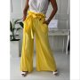 Дамски панталон със широк крачол в жълто 