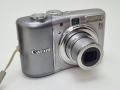Canon PowerShot A1100 IS 12.1 MP 4x Zoom Digital Camera-Silver , снимка 1