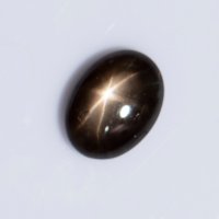 Черен звезден сапфир 0.94ct 6-лъчева звезда овален кабошон, снимка 1 - Други - 41635756