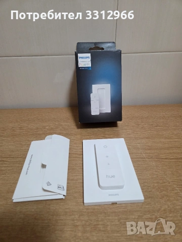 интелигентен димер за осветление Philips Hue (модел 562777). 