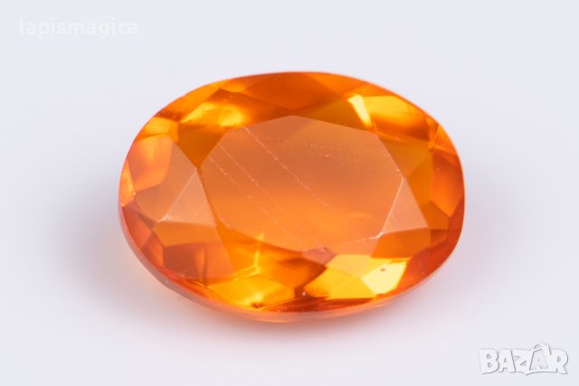 Мексикански огнен опал 0.72ct VS овална шлифовка