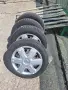 комлект гуми с джанти 14 4x100 4.5j,за тойота айго с оригиналните тасове, снимка 3